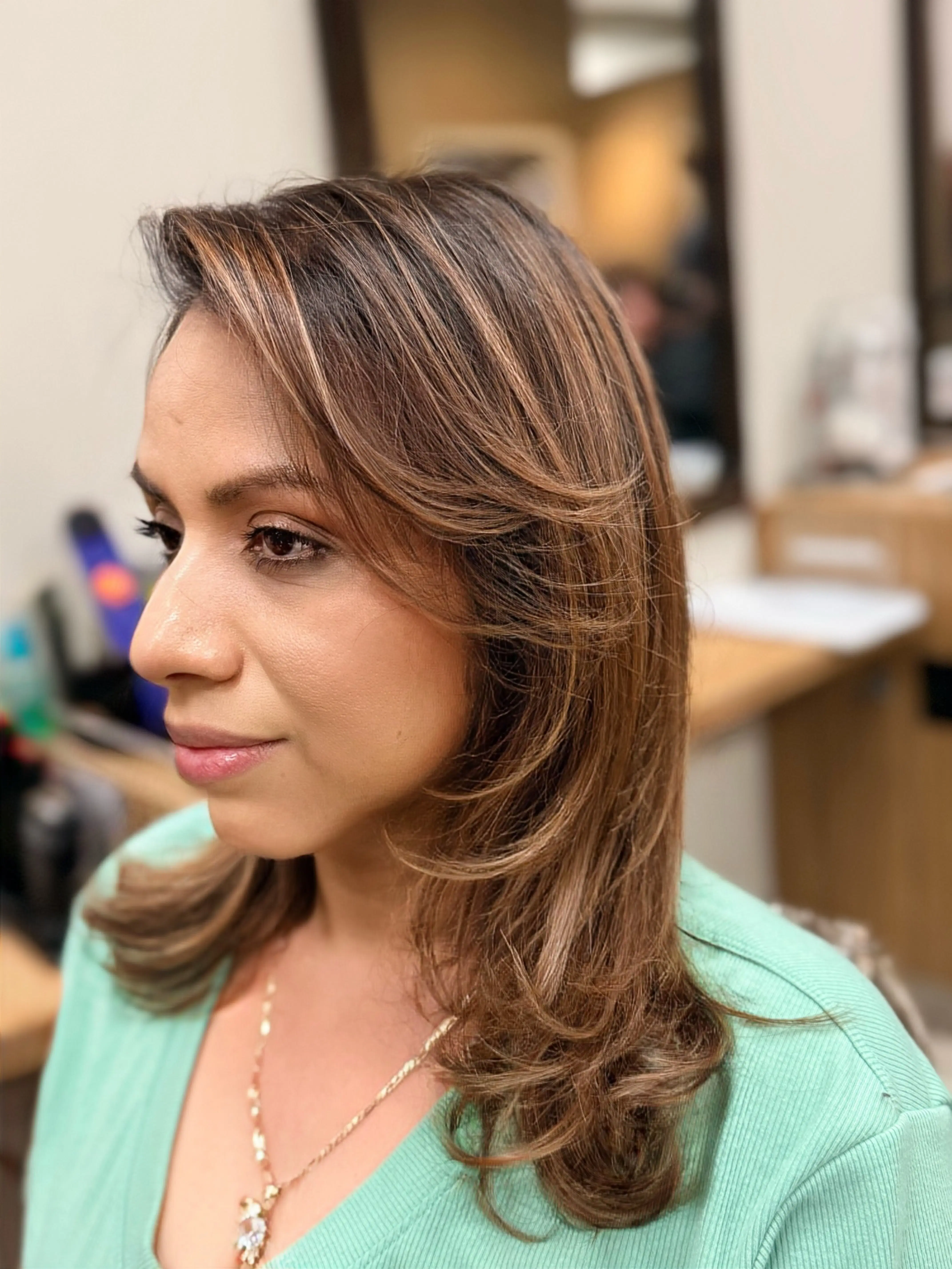 Long brunette hair with caramel ribbons around the face