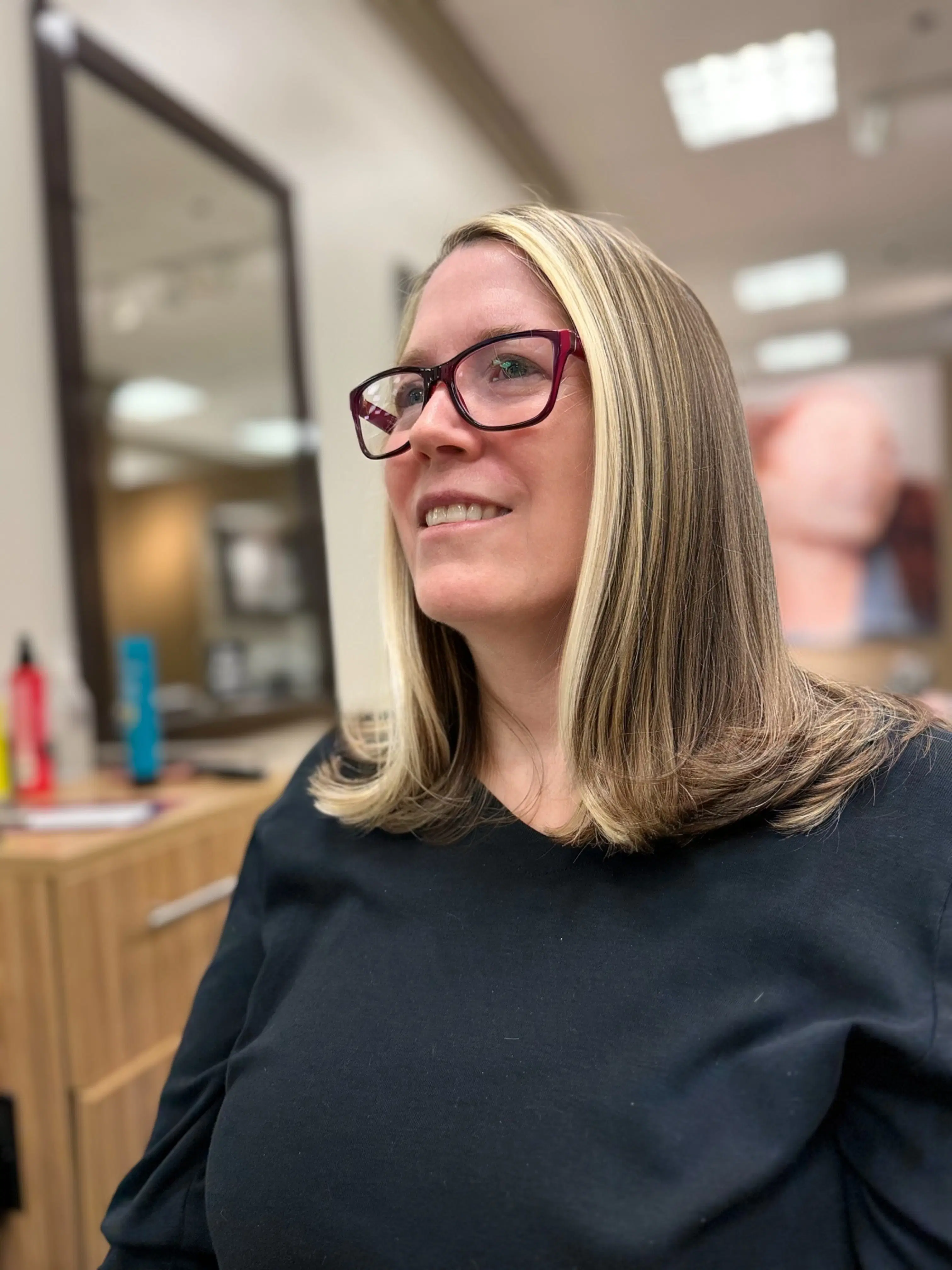 Bright blonde pieces at the face on a straight, shoulder-length cut