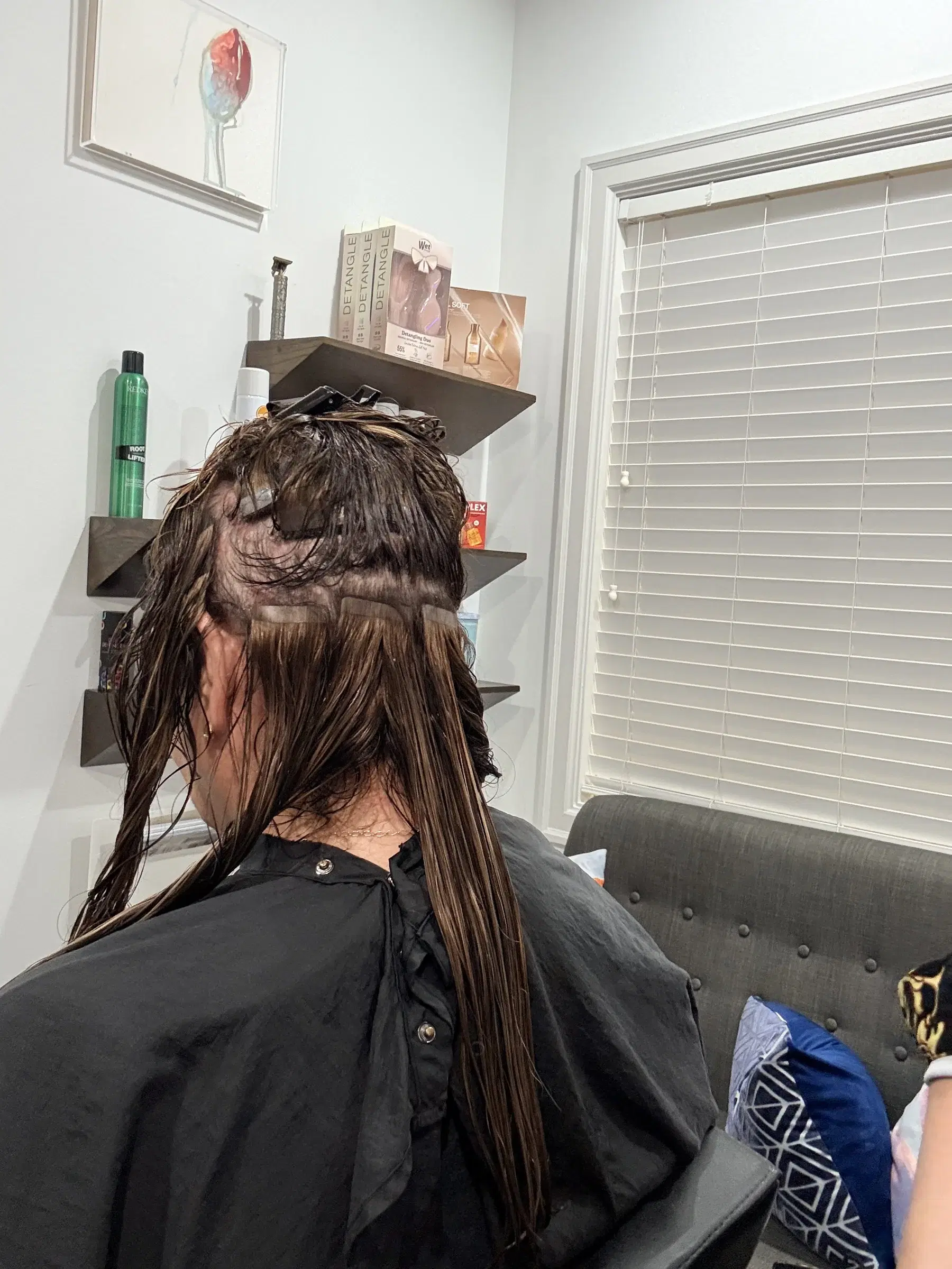 Color sectioned through the hair during the appointment