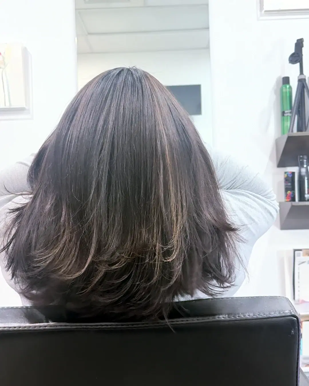 Soft brunette lob from the back after a cut and blow-dry