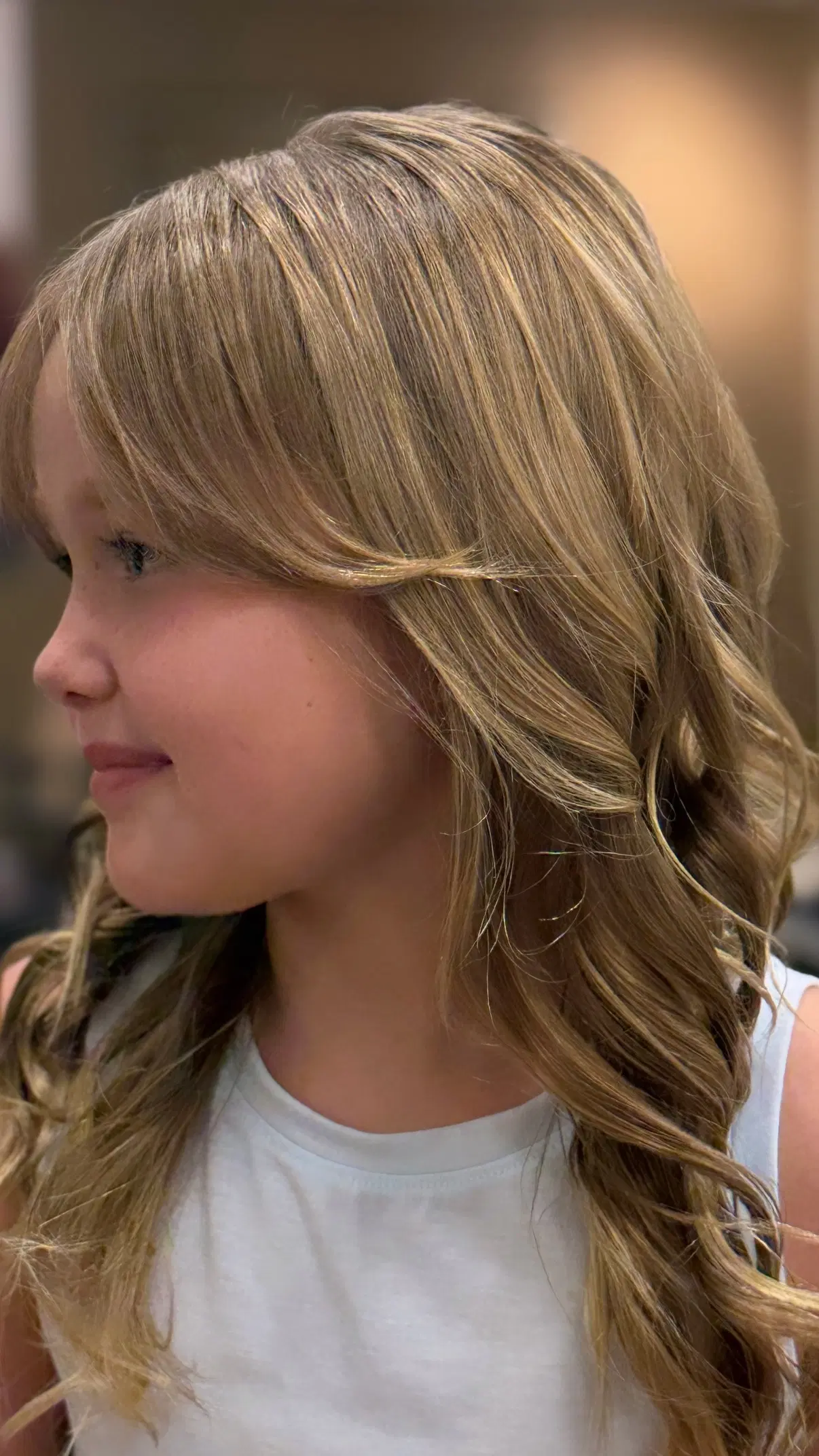 Kids’ haircut and style with soft face-framing