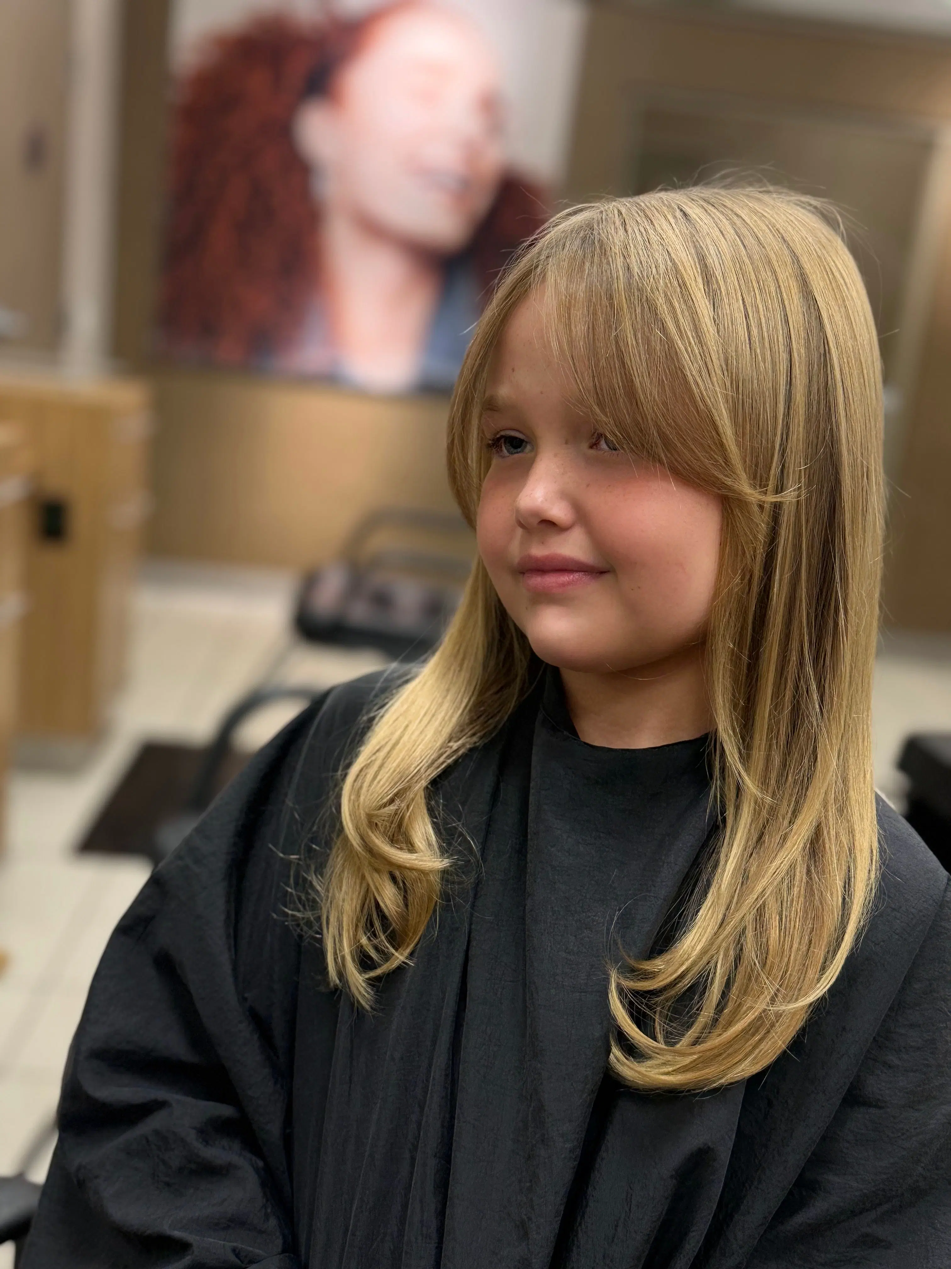Kids’ haircut and style with soft face-framing