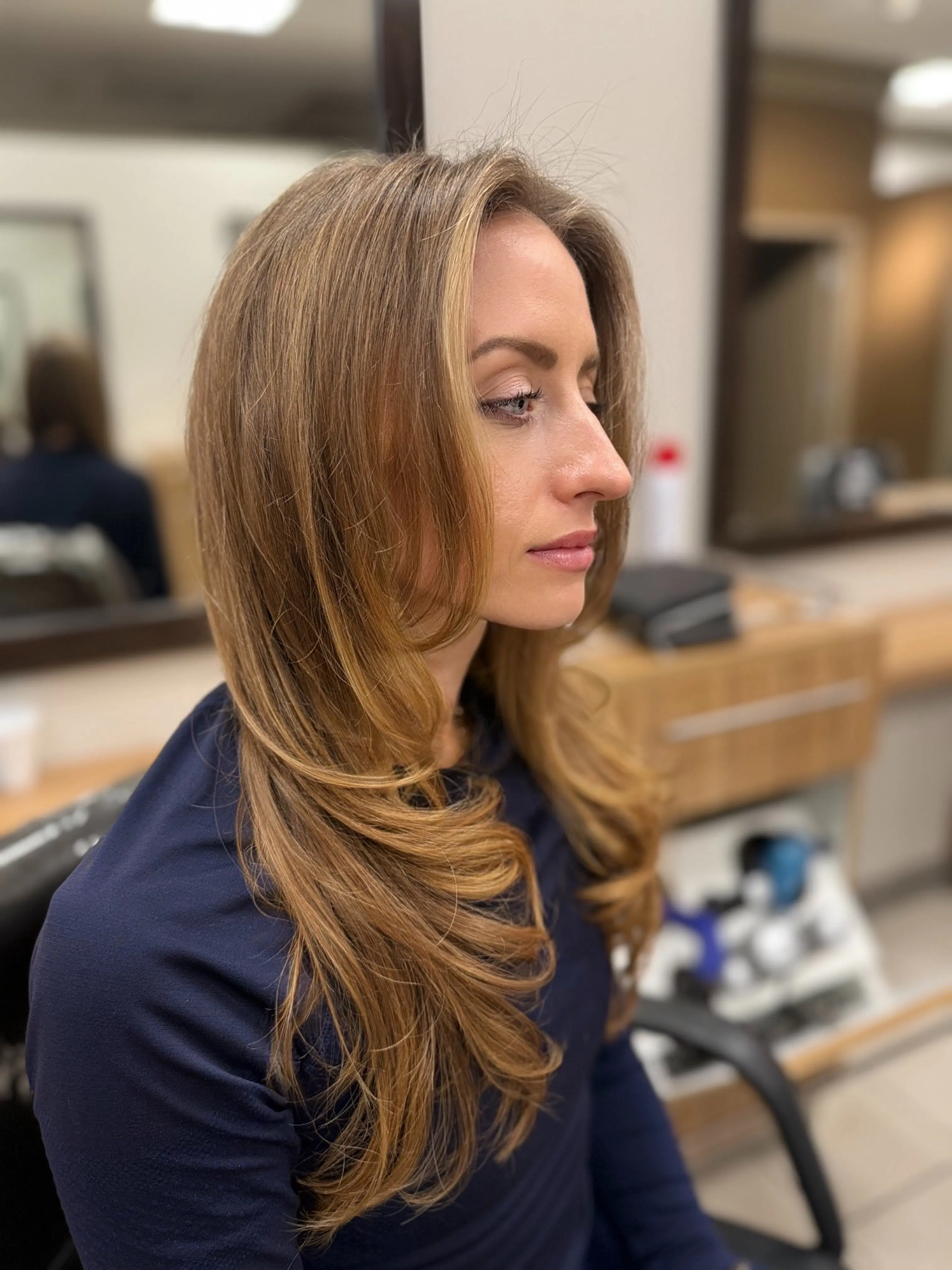 Long honey balayage with soft face-framing layers
